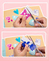 Phomemo thermal transparent stickers being cut into shapes like butterfly and rose for creative use