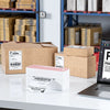 Phomemo PM241-BT 4¡±x6¡± Shipping Label Printer printing shipping labels in a warehouse